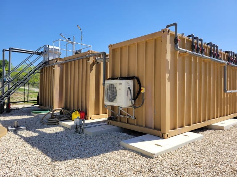Industrial water treatment container with piping and filtration system at A3 USA, showcasing innovative water management technology.