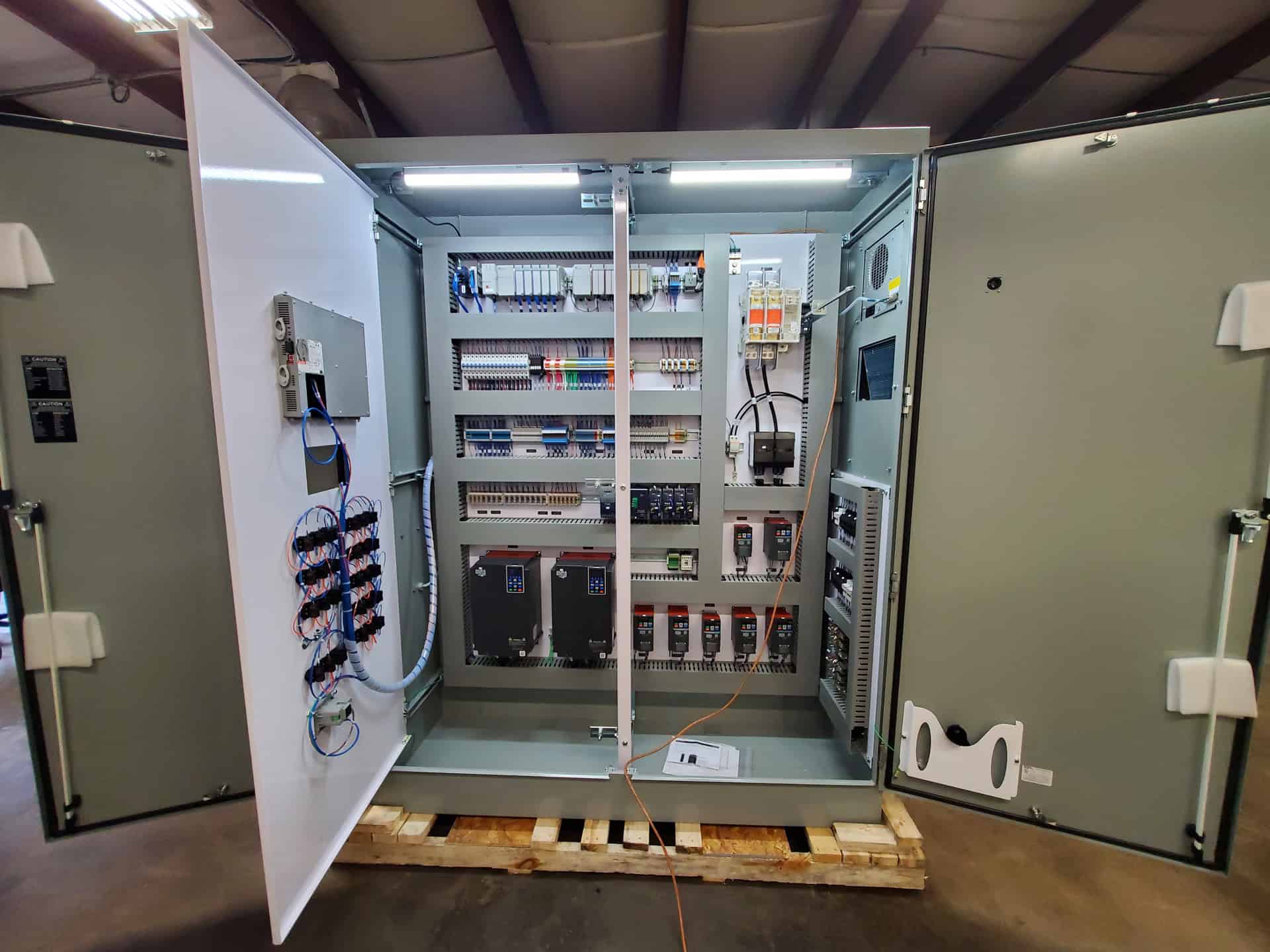 Industrial electrical control panel for automation and machinery, featuring organized wiring and electronic components, essential for industrial automation solutions by A3 USA.