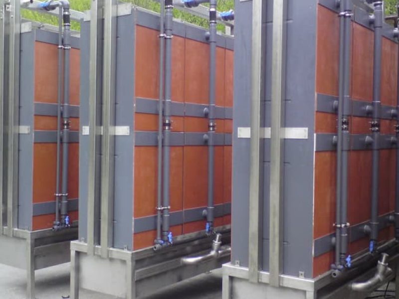 High-capacity modular water treatment tanks with durable piping and infrastructure, designed for industrial and municipal water filtration systems.